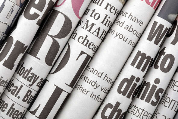 Several folded newspapers pressed together, illustrating a story about the latest regional newspaper ABC figures, showing no daily regional paper now has a print circulation of 20,000 or more.