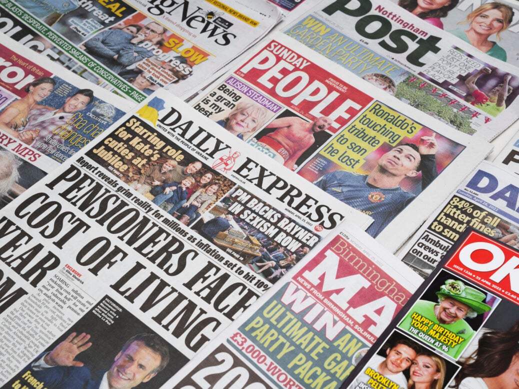 The Sunday People and Daily Express at the centre of a pile of Reach newspapers. Picture: Reach