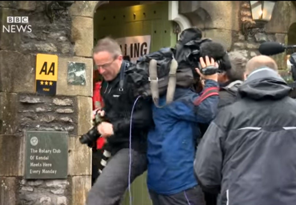 VIDEO: Photographer and cameraman scrap outside polling station in media scrum