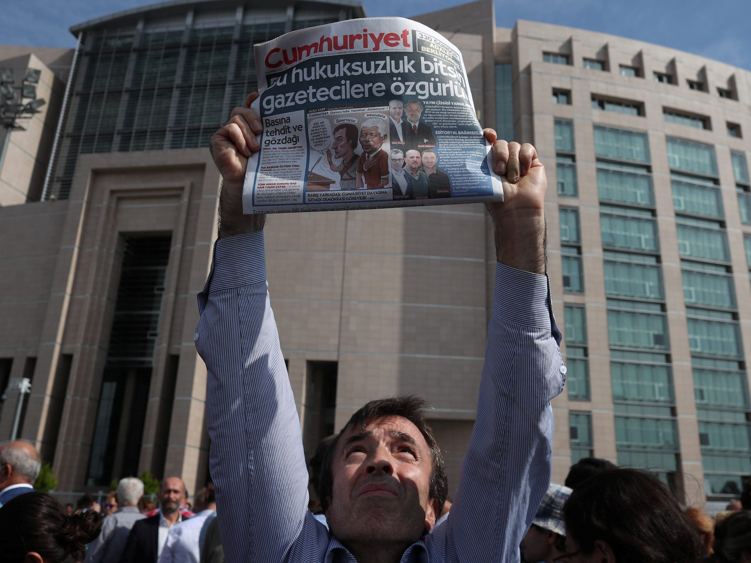 13 Turkish opposition newspaper staff convicted of terrorism offences after trial ‘aimed at silencing’ their reporting