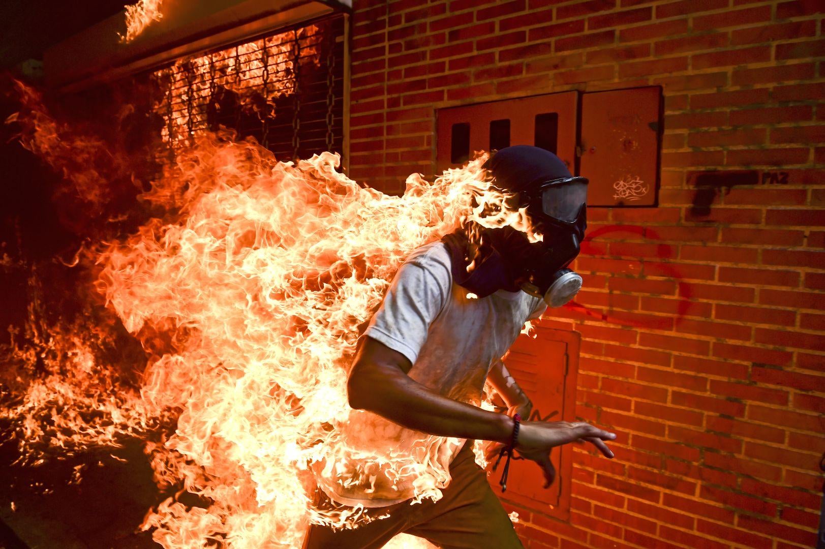 AFP's Ronaldo Schemidt wins World Press Photo of the Year for picture of burning Venezuelan protester