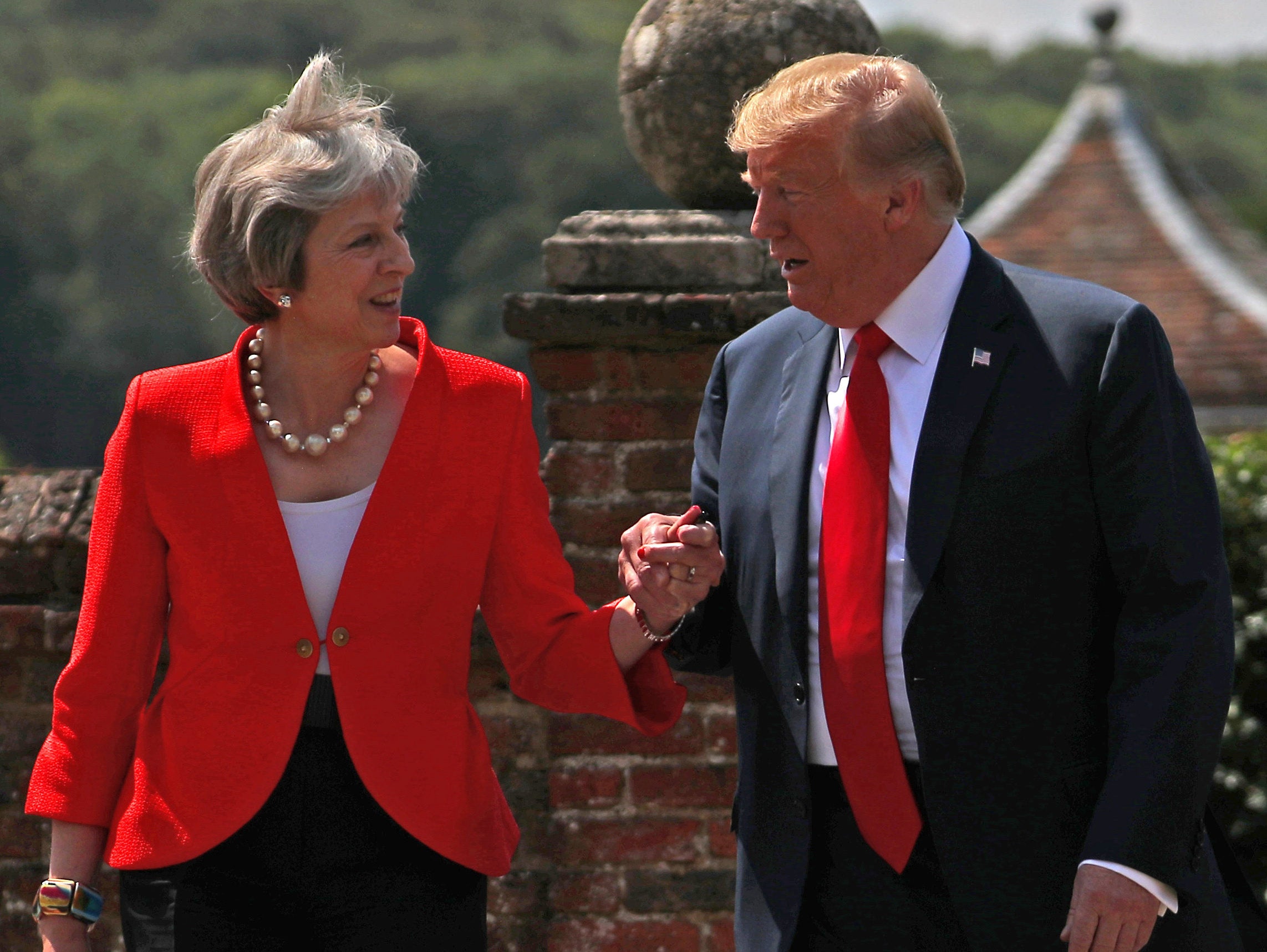 May tells Trump 'don't worry it's only the press' as he cries 'fake news' over claim he criticised her in exclusive Sun interview