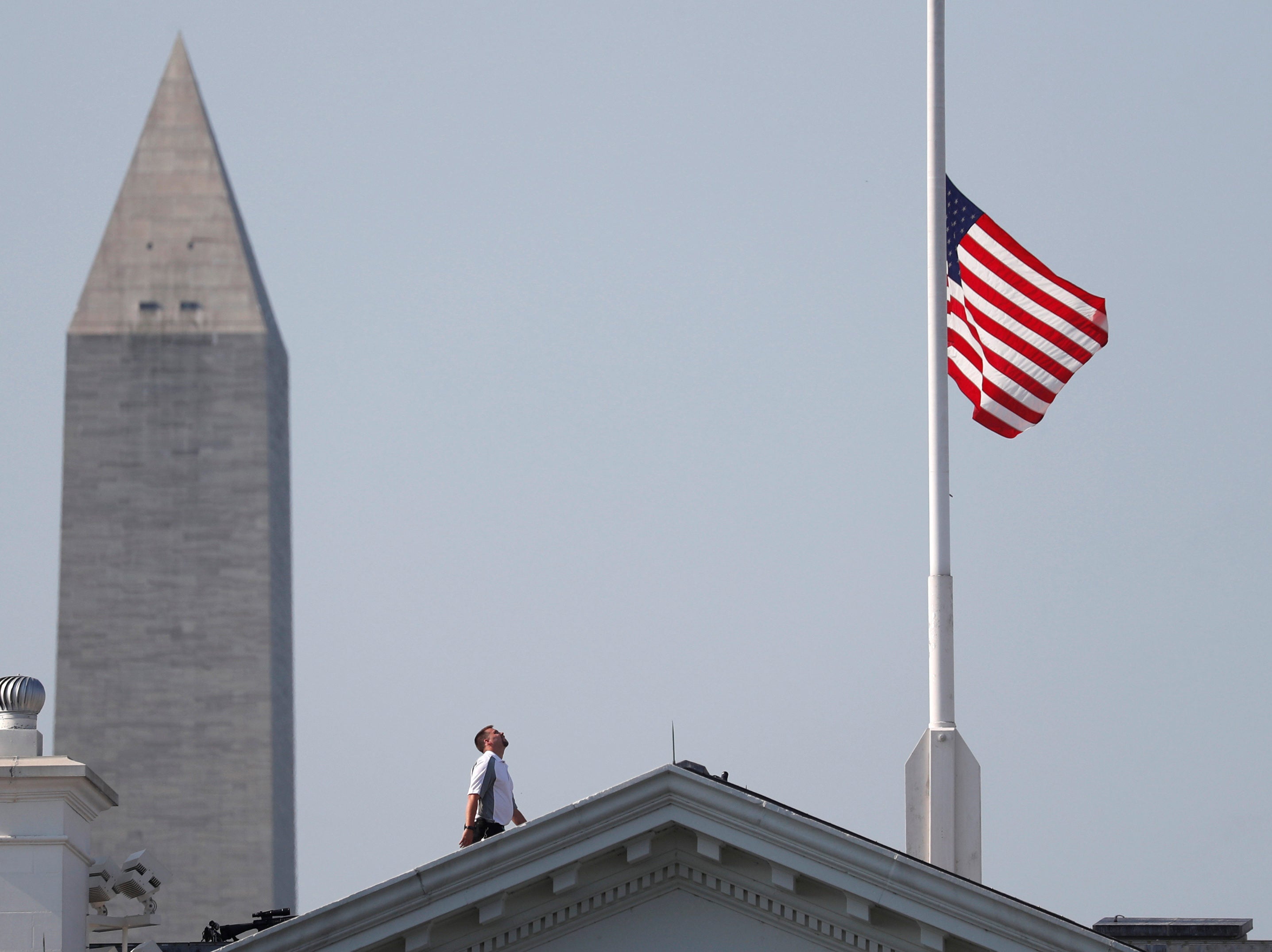 US flags flown at half-mast for five victims of shooting at Capital Gazette newsroom