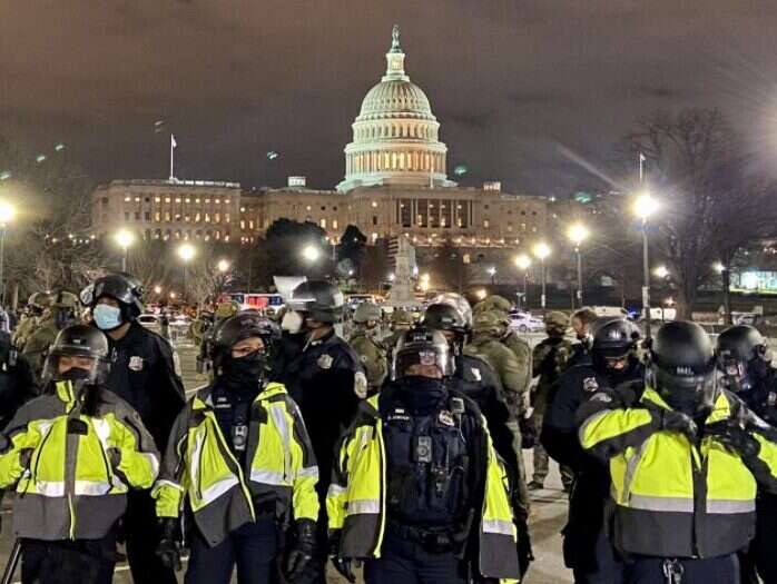 ITV journalist's report from inside US Capitol: 'A crowd of furious men in camouflage wielding heavy wooden sticks encircled us'