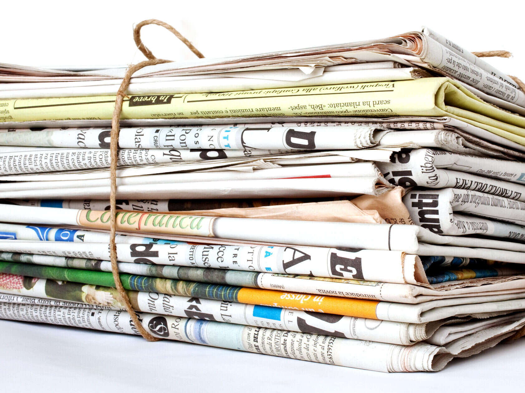 UK local newspaper closures: Print newspapers stacked