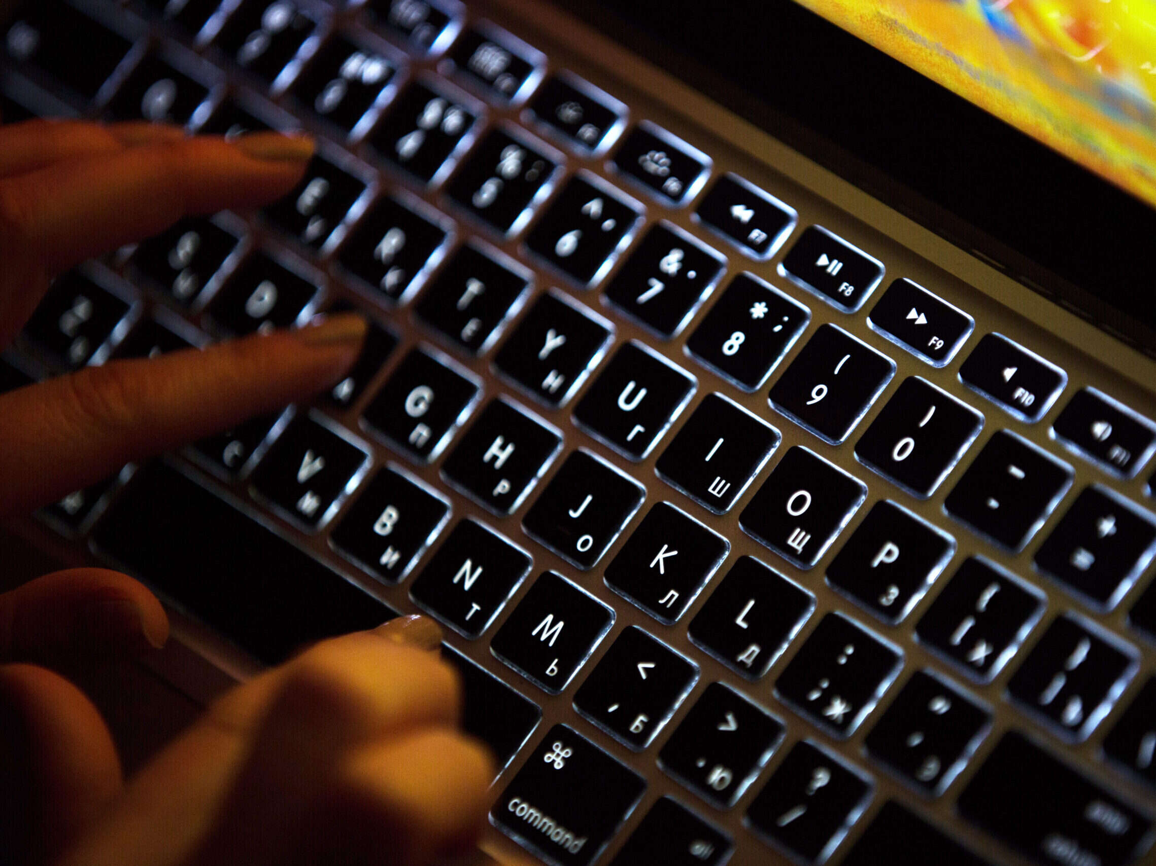 These anonymous fingers hovering over a Macbook keypad might just be about to do gendered disinformation