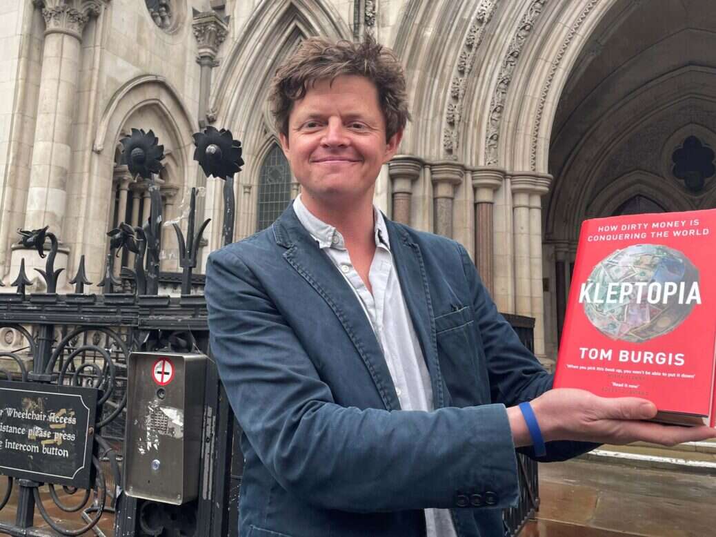 Tom Burgis outside the High Court after a libel case against him was dropped