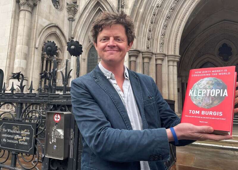 Tom Burgis outside the High Court after a libel case against him was dropped