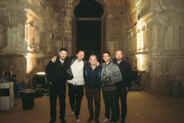 The Sun's Bizarre editor Simon Boyle with Coldplay