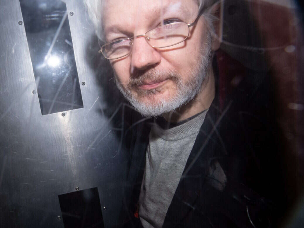 Julian Assange in 2020|Julian Assange sign outside court|Julian Assange in court
