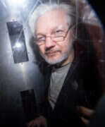 Julian Assange in 2020|Julian Assange sign outside court|Julian Assange in court
