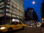 new york times office from street with taxi going past in front