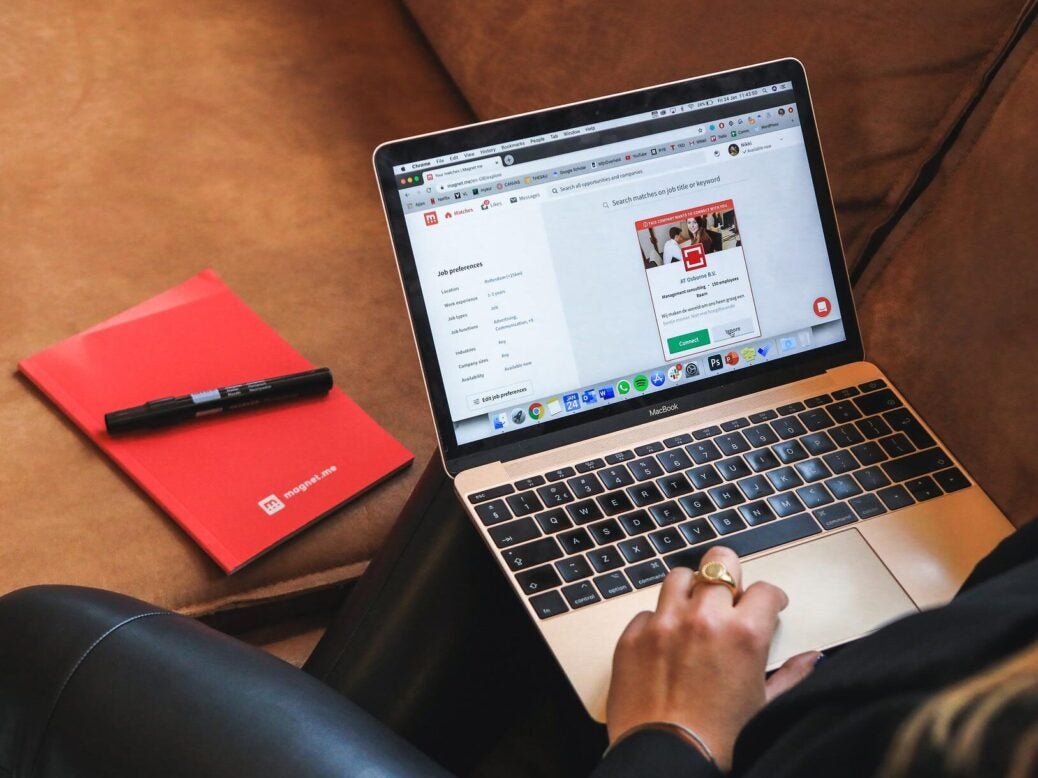 Woman on laptop/macbook on job search