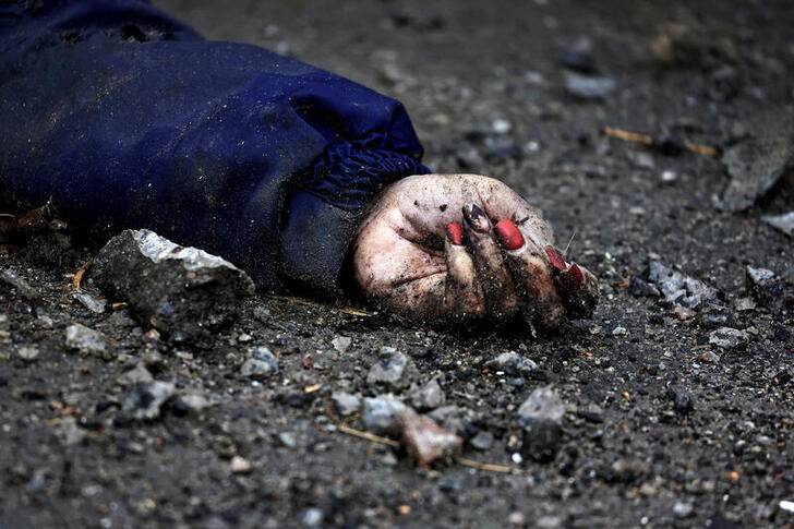 Reuters Ukraine: Image shows a dead woman's hand on the ground