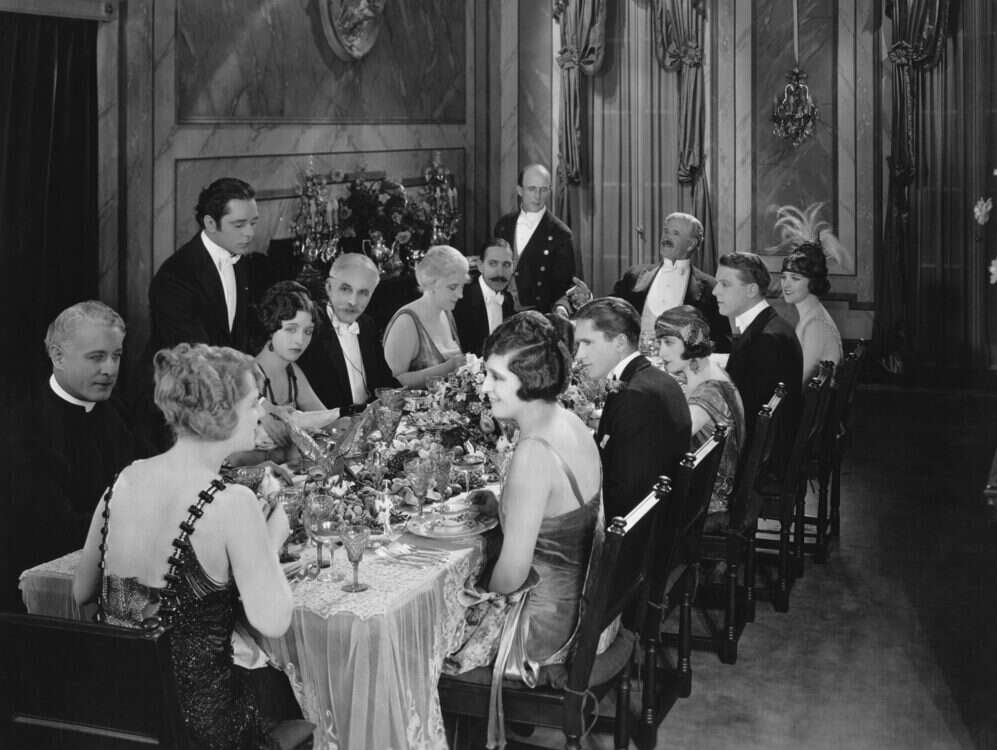 Posh dinner party to illustrate upper class journalists story