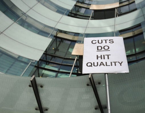 A BBC employee holds a placard outside Broadcasting House in central London on February 18, 2013, as he mans a picket line during a strike over compulsory redundancies.Today February 18, 2013, BBC journalists began a 24-hour strike in protest at compulsory redundancies, causing possible disruption to the broadcaster's television and radio output. Members of the National Union of Journalists (NUJ) walked out at midnight (local time and GMT) at the end of Sunday's programming, over job cuts which are expected to affect BBC Scotland, Five Live, the Asian Network and the World Service. AFP PHOTO / CARL COURT (Photo credit should read CARL COURT/AFP via Getty Images)