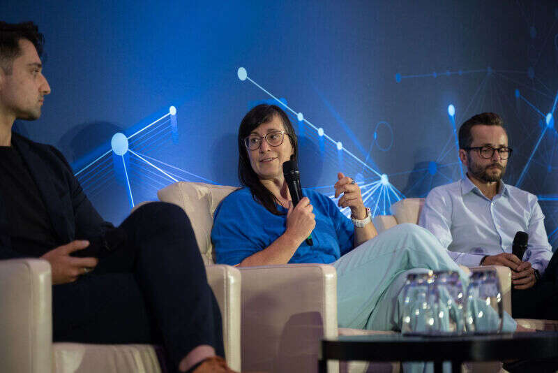 Mediahuis head of data and insights Trui Lanckriet (centre) speaks during a session on how generative AI can enhance journalism. She is sat alongside Frankli and Open Origins' Ari Abelson and ITN's Jon Roberts.