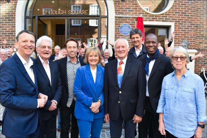 A group of former LBC staff pose in front of 12 Gough Square and the newly-unveiled plaque.