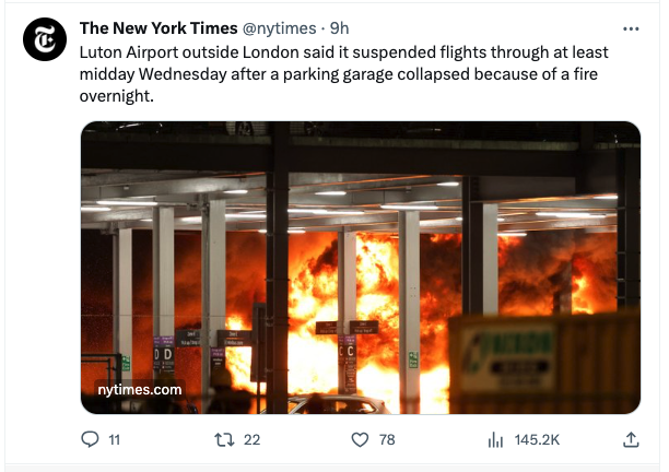 A New York Times tweet about the Luton Airport fire. The picture shows flames tearing through a car park; above the image the tweet reads: "Luton Airport outside London said it suspended flights through at least midday Wednesday after a parking garage collapsed because of a fire overnight."