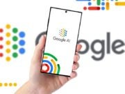 Hand holding phone showing Google AI logo