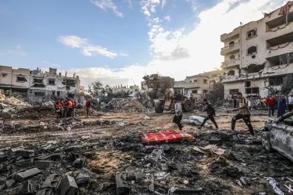 The Palestinian Civil Defense searches for survivors in a house for the Mukhaimir family and neighboring houses after an Israeli raid in the city of Rafah, south of the Gaza Strip, on October 17 2023. (Shutterstock)