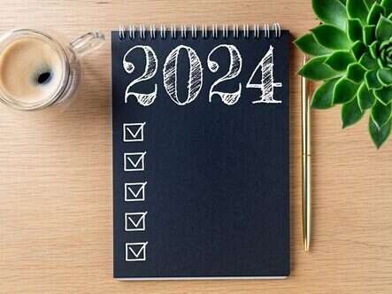 A notebook sits on a desk with '2024' across the cover.