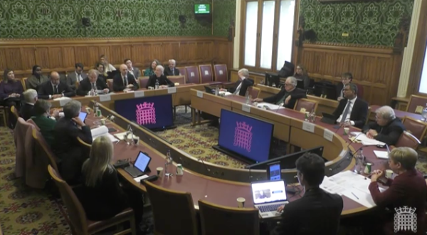 Executives from the Financial Times, DMG Media, News UK and Guardian Media Group are seen from a wide angle giving evidence at the Digital and Communications Committee at Parliament.