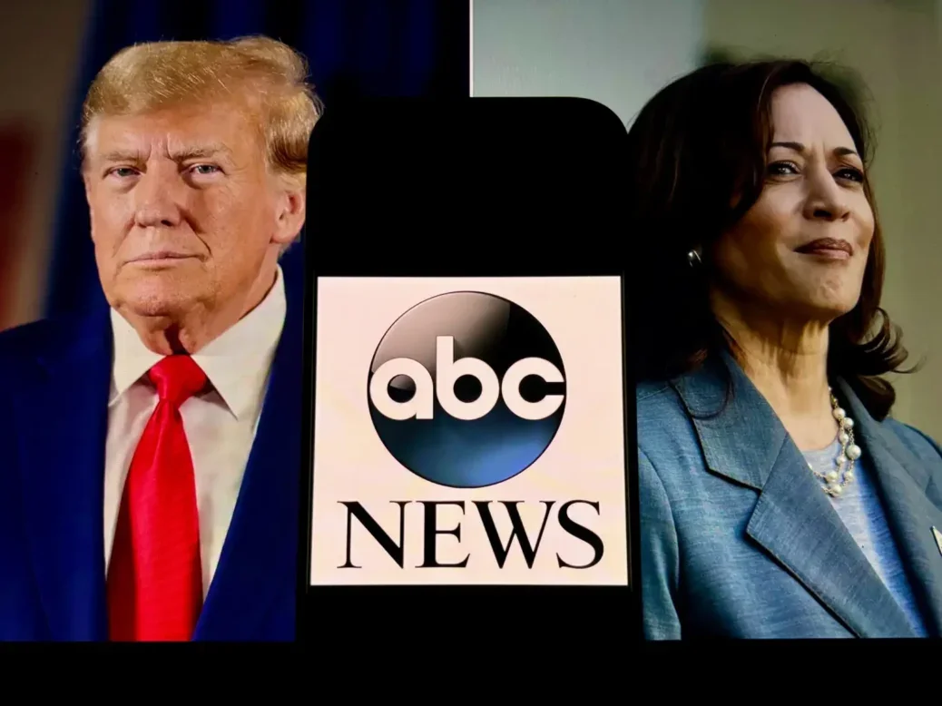 Photos of Donald Trump, left, and Kamala Harris, right, with phone showing logo of ABC News superimposed between them