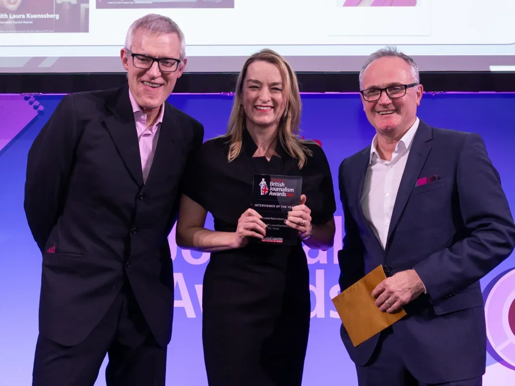 Laura Kuenssberg picks up the Interviewer of the Year award from Jeremy Vine and judge Rob McGibbon at the British Journalism Awards 2024. Picture: ASV Photography/Press Gazette