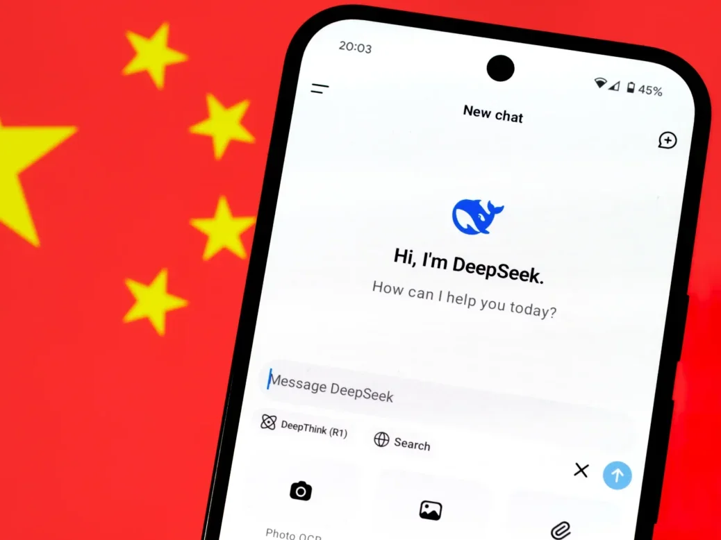 DeepSeek AI app chat seen on a smartphone and blurred Chinese flag on the background. Picture: Shutterstock/mundissima