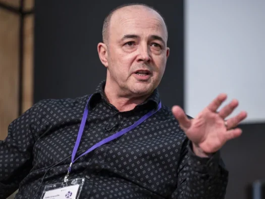 Newsquest editorial development director Toby Granville appears on stage at the Society of Editors Media Freedom Conference in London, revealing that his company now employs 36 AI-assisted reporters, up from seven a little over a year ago.