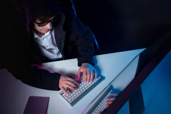 Mystery person at laptop. Picture: Shutterstock