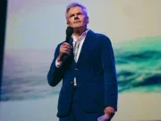 Die Zeit CEO Dr Rainer Esser speaking at the WAN-IFRA World News Media Congress in Krakow on 5 May 2025. Standing on stage holding a microphone dressed in a suit