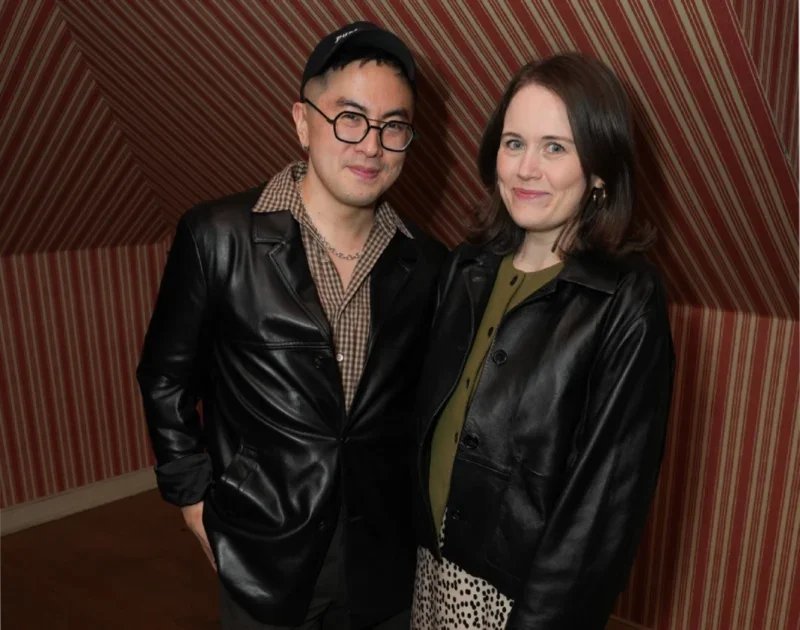 Bowen Yang and Charlotte Owen standing together at a Bustle event