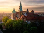 Wawel Castle in Krakow, Poland. Castle in middle of city. Sky is soft summer sunrise lighting.