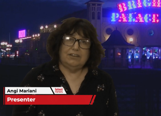 A screenshot of presenter Angi Mariani reporting in front of Brighton Palace Pier for Latest TV