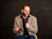 Sky News executive editor Jonathan Levy speaking into a microphone and gesturing