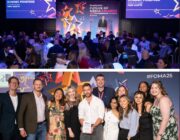 Two images from Future of Media Awards 2025: Dominic Ponsford on stage in front of gala dinner audience, and group of winners on stage