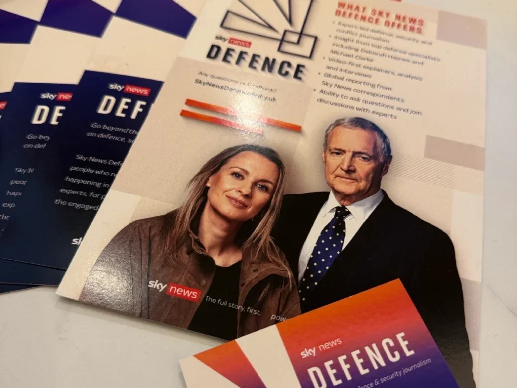 Brochures about Sky News defence app laid out on a table