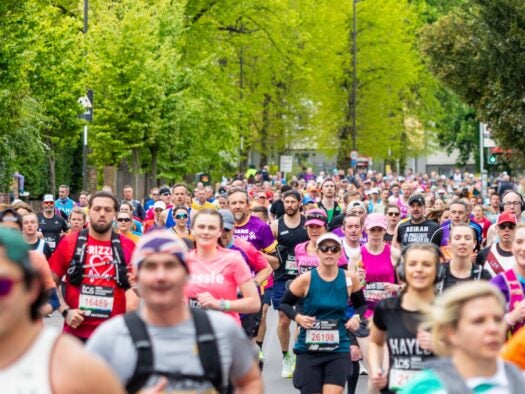 21 April 2024, London: Groups of people running in the London Marathon 2024. Poicture: Mikecphoto/Shutterstock
