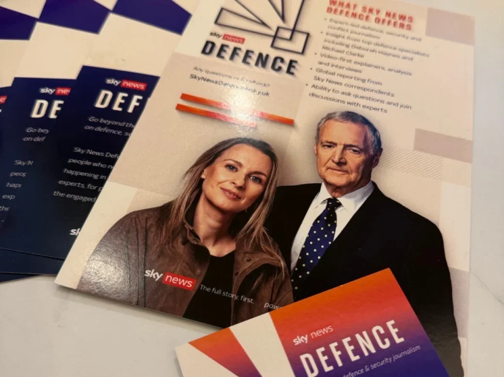 Brochures about Sky News defence app laid out on a table