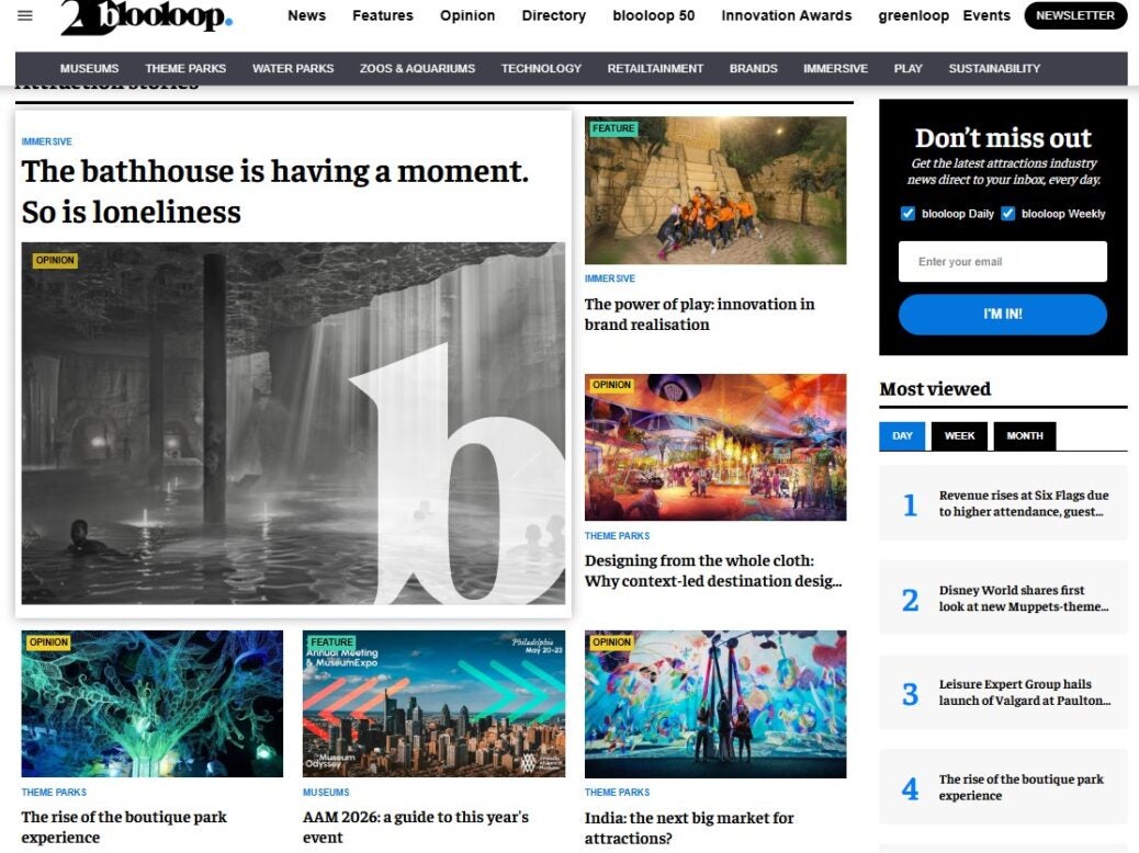Blooloop homepage, with headlines including 'The bathhouse is having a moment. So is loneliness' and 'The power of play: innovation in brand realisation'