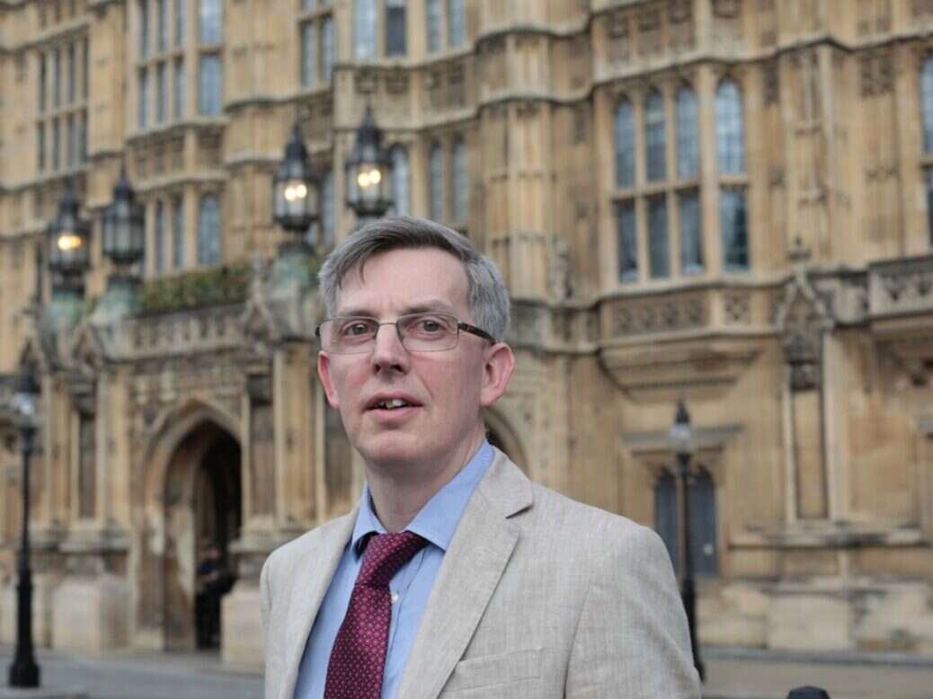Andrew Sparrow in front of Houses of Parliament.