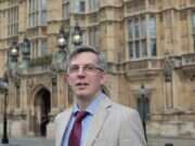 Andrew Sparrow in front of Houses of Parliament.