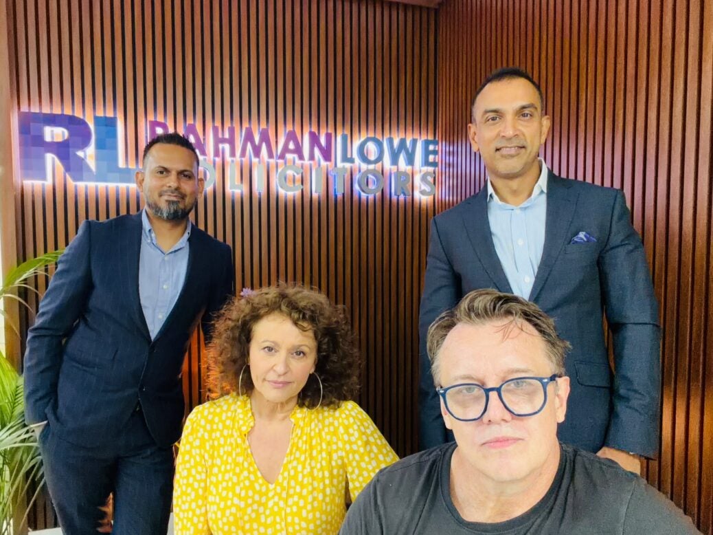Lawyers for Rahman Lowe Solicitors posing for picture with Nadia Sawalha and her husband Mark Adderley.