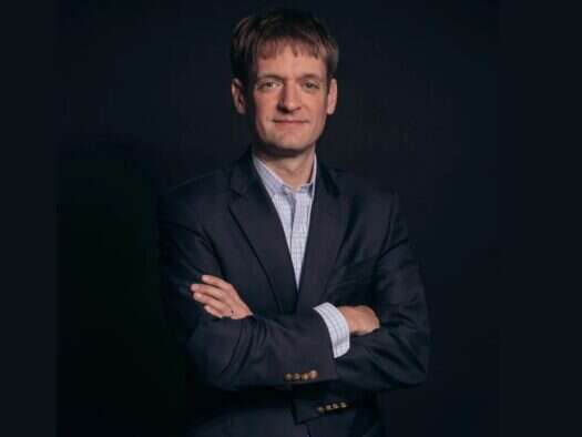Headshot of Axios publisher Nicholas Johnston