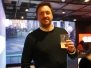 Paul Vale, pictured in a bar holding a drink