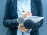 Reporter holding pad and microphone. Picture: Shutterstock/wellphoto