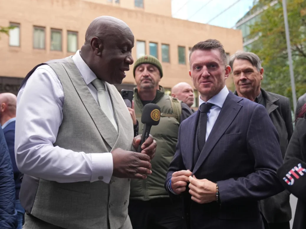 Tommy Robinson, whose real name is Stephen Yaxley-Lennon, taking part in a livestream outside Southwark Crown Court surrounded by other men